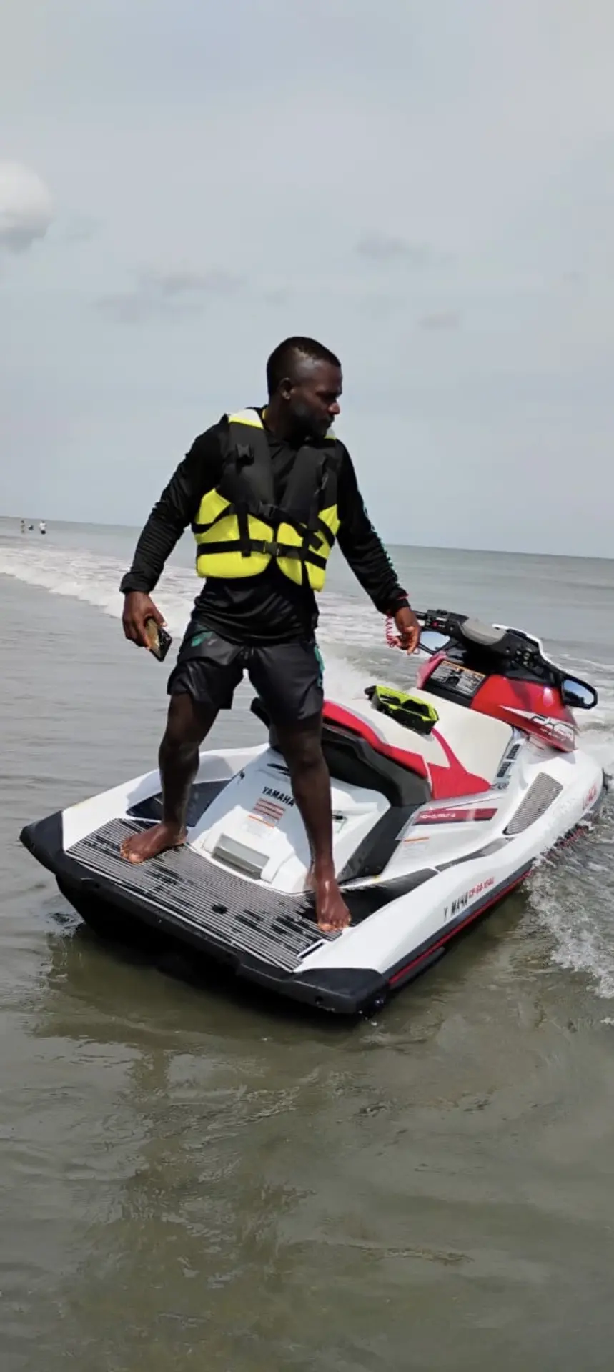 Surf 420 instructor preparing safety equipment for jet ski riders