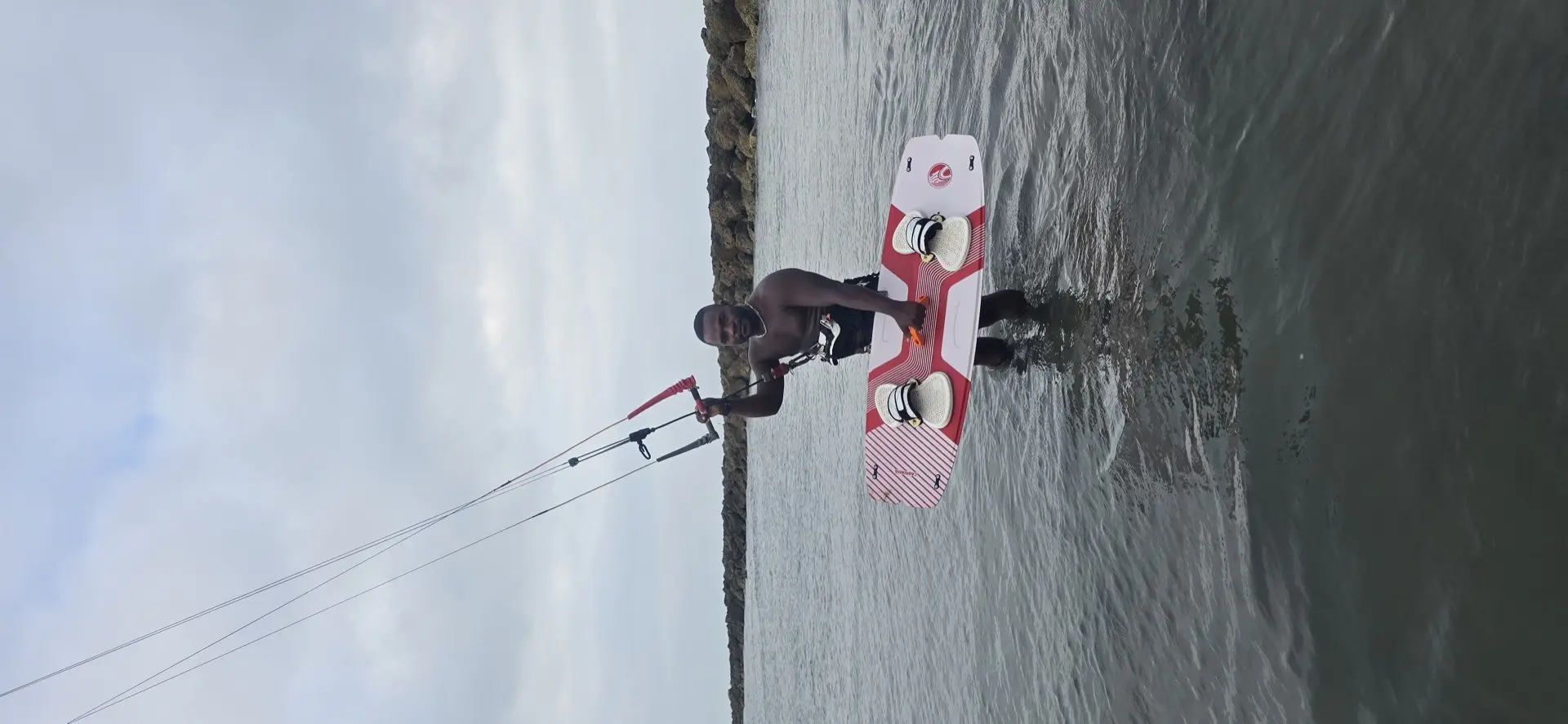 Kiteboard and kite on the water