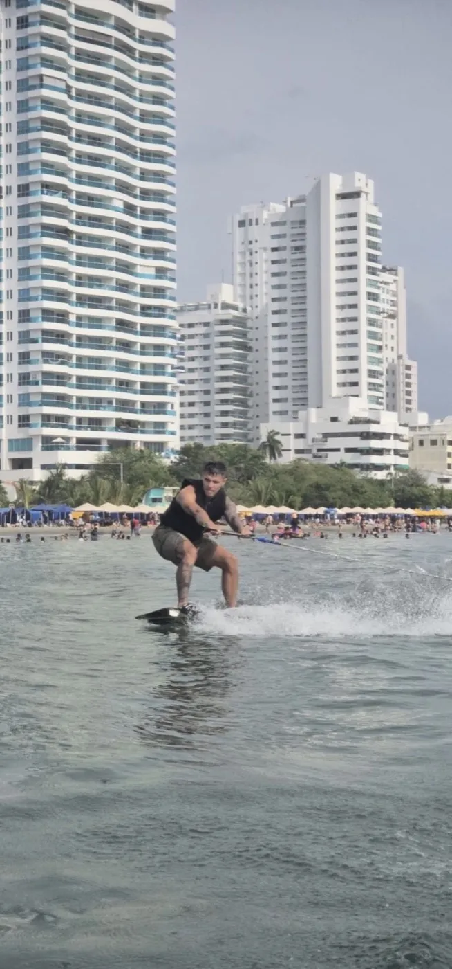 Wakeboard student getting up from the water